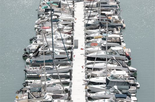 Horizontal nautical wall print featuring a marina packed with white boats docked at the San Diego harbor.