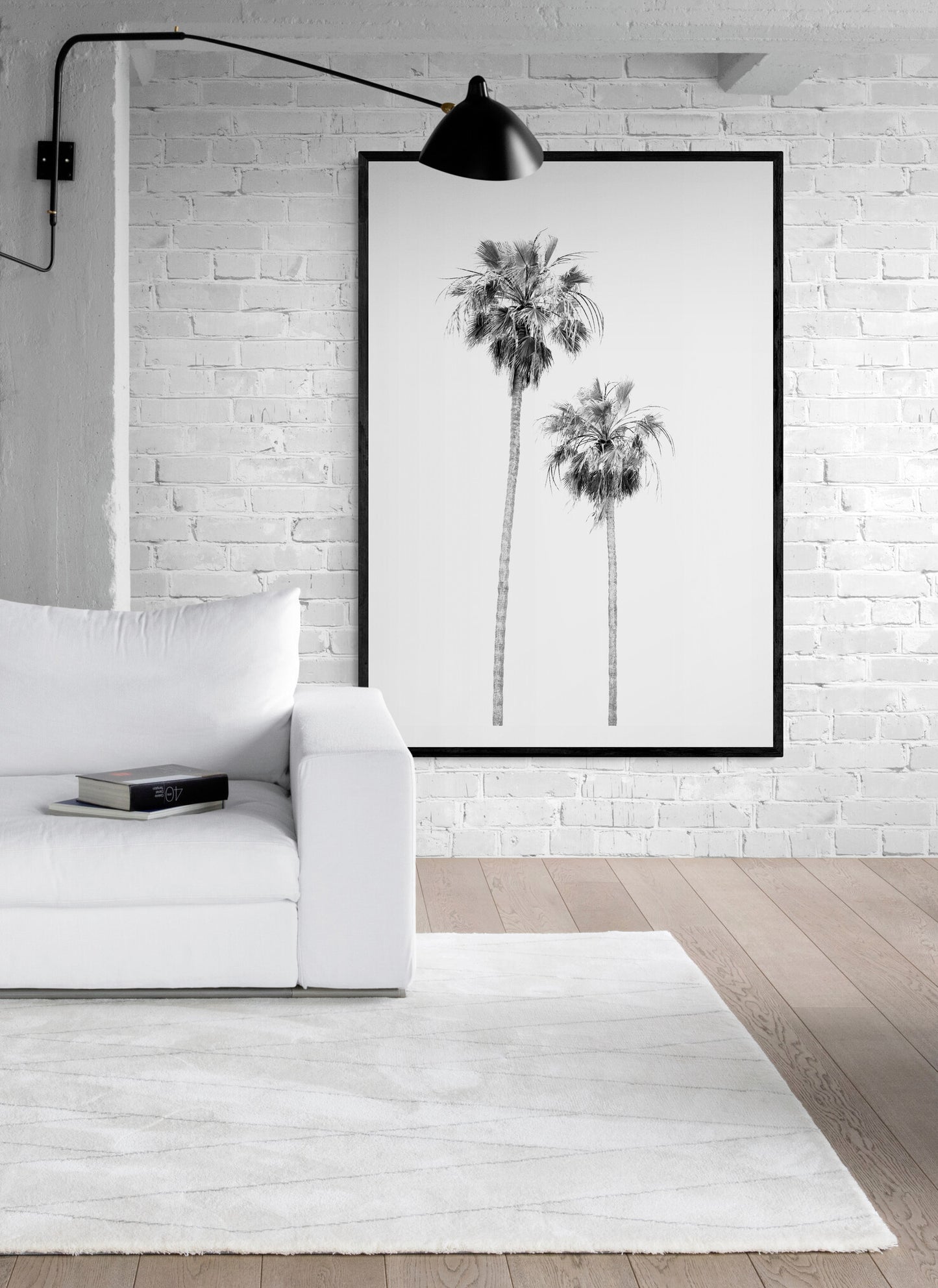 Minimalist palm tree print in black and white, showcasing two tall palm trees against a bright background. This vertical wall art is a coastal palm tree print. Photograph in minimalist mock up.