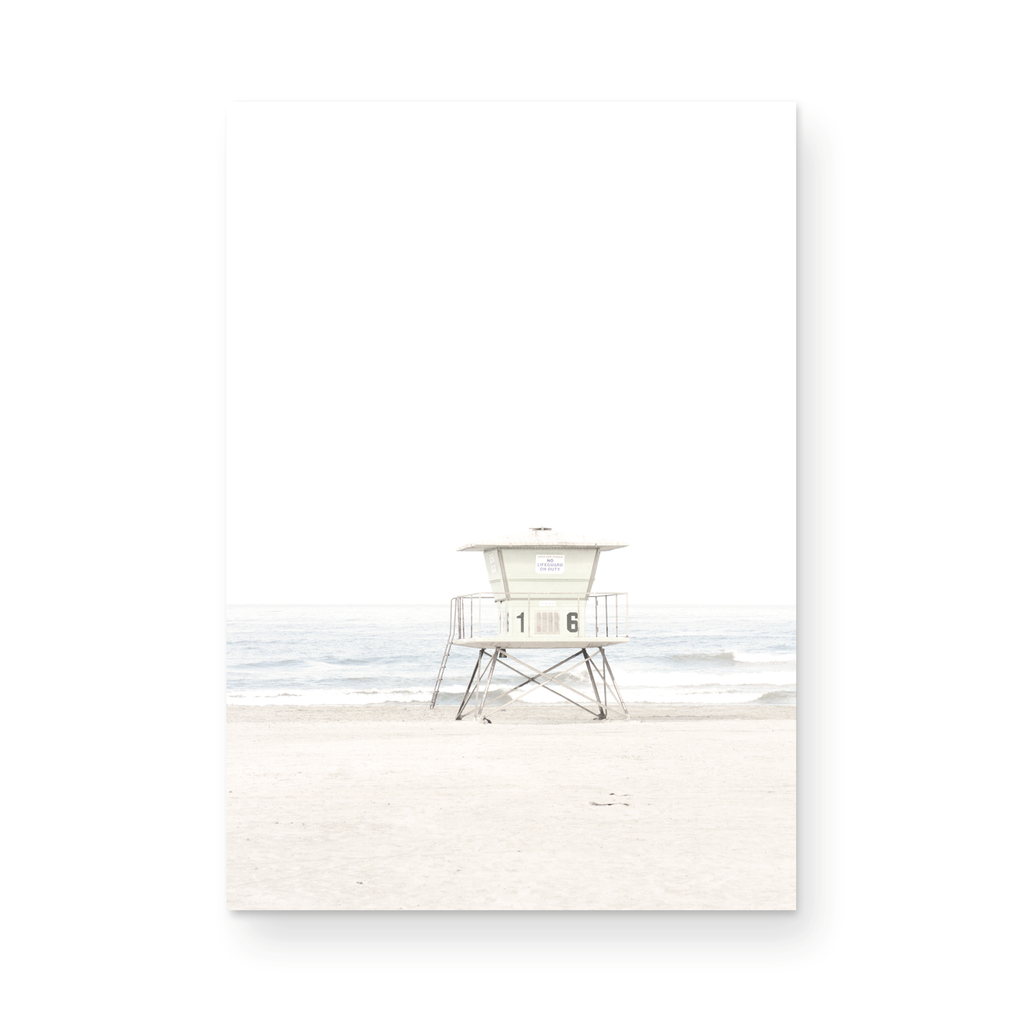 A vertical beach art close-up of a pale lifeguard tower (16), with ocean waves in the distance, on a San Diego Beach. Photograph in minimalist mock up.