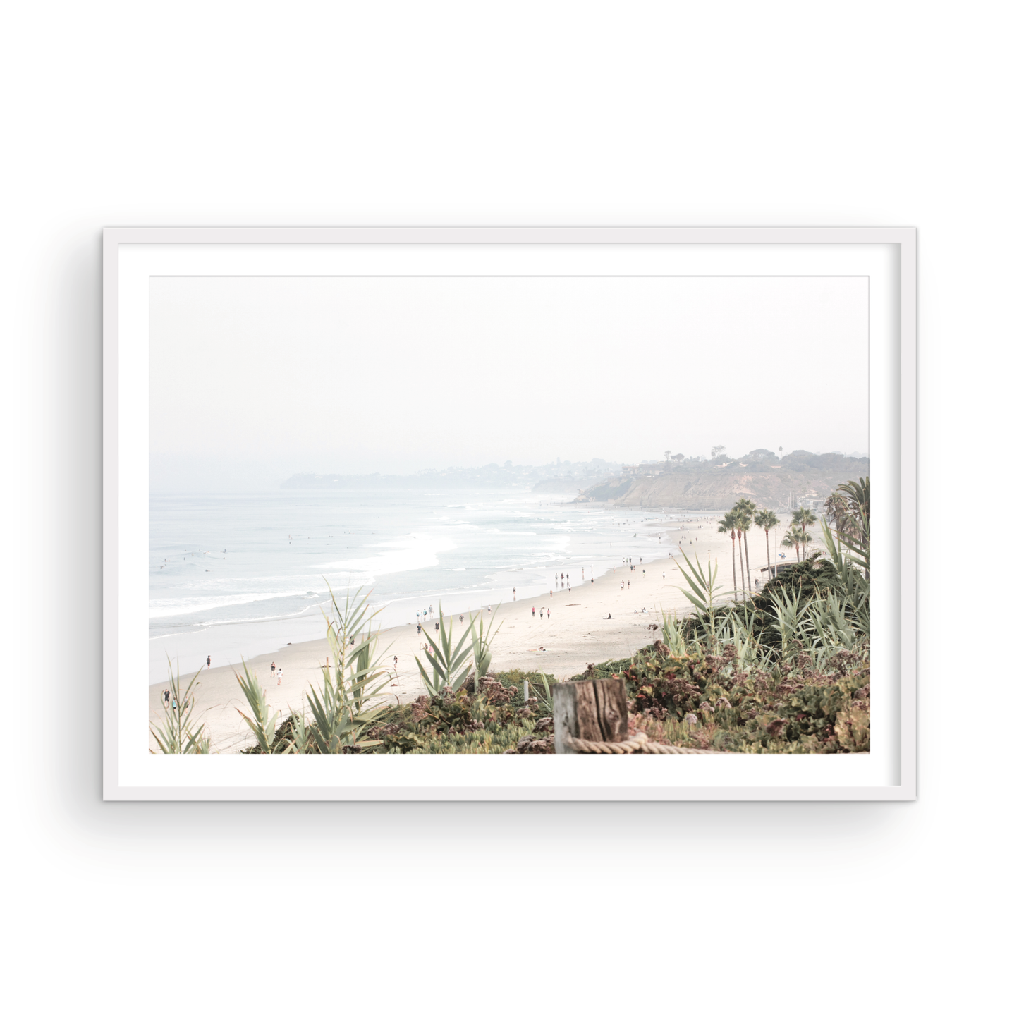 Landscape San Diego beach print showing seascape with gentle ocean waves in the water near a sandy cliff. Photograph in minimalist mock up.
