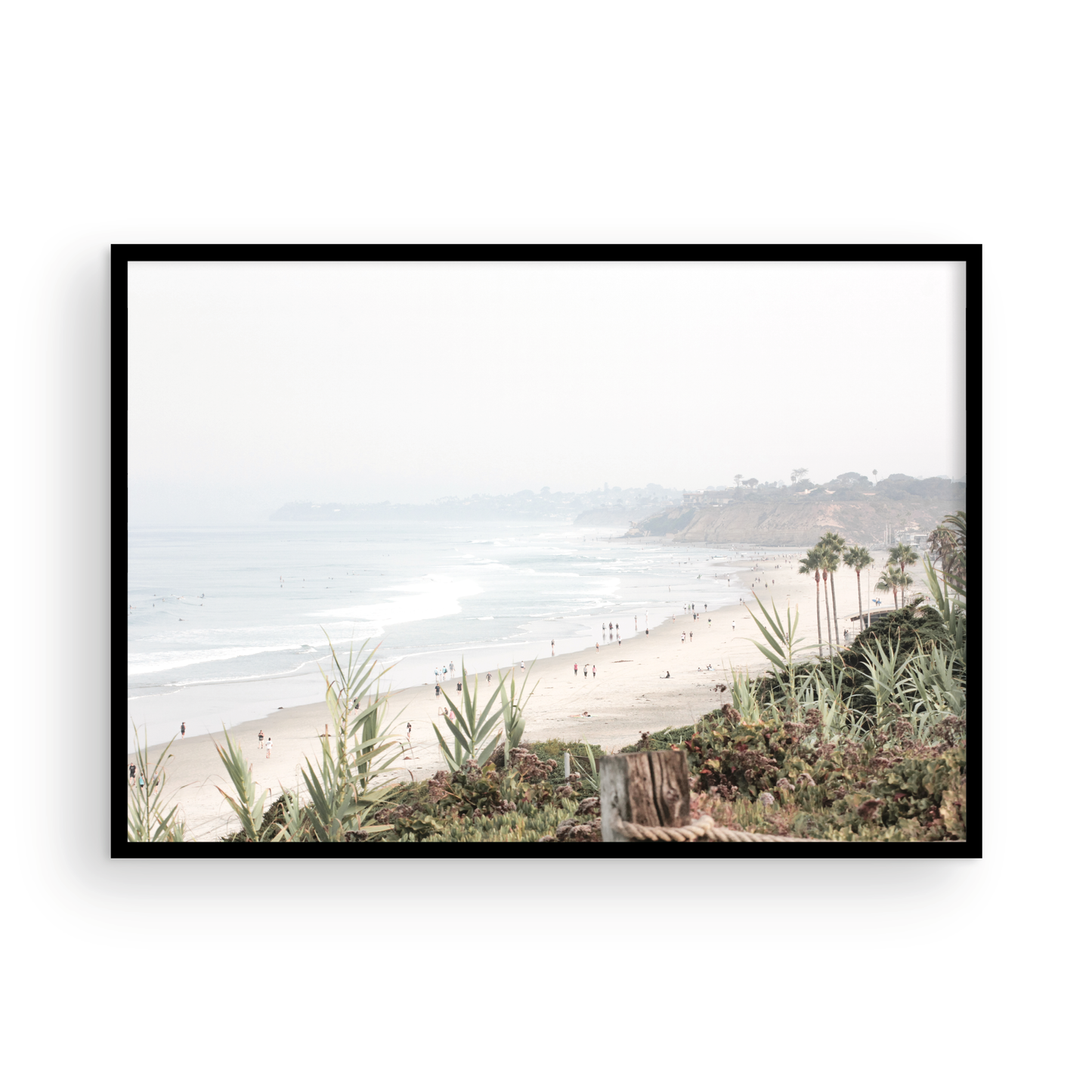 Landscape San Diego beach print showing seascape with gentle ocean waves in the water near a sandy cliff. Photograph in minimalist mock up.