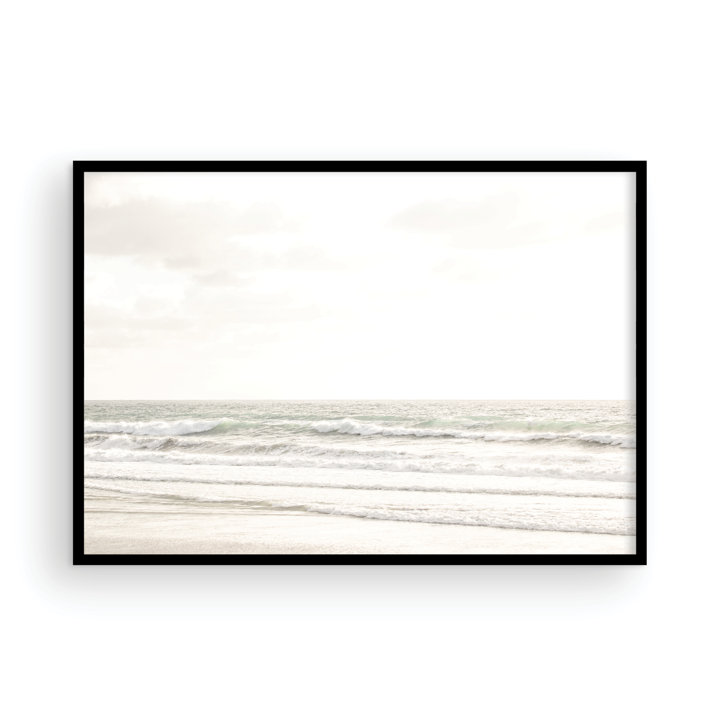 Horizontal minimalist ocean print of gentle ocean waves rolling onto a sandy shoreline at Moonlight Beach, San Diego, under a bright, soft sky. This calm beach print provides a serene seascape. Photograph in minimalist mock up.
