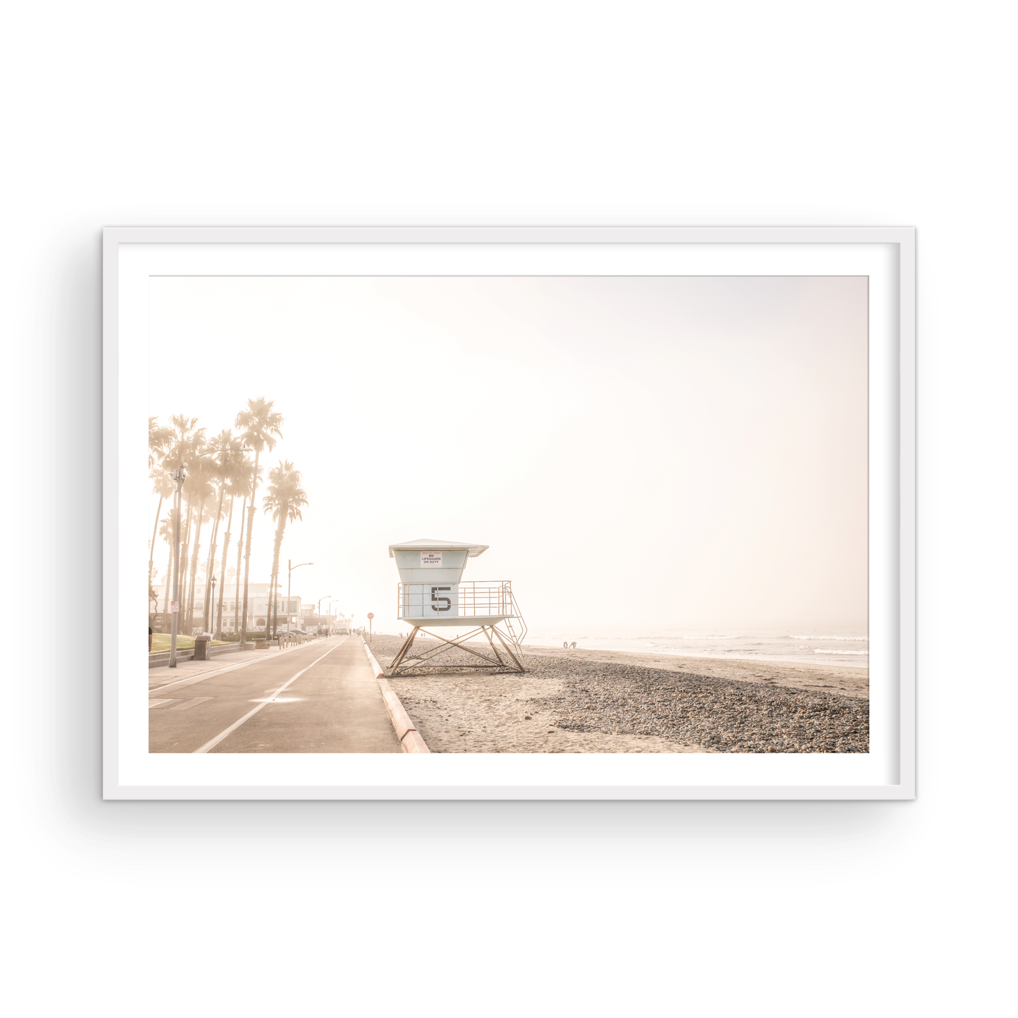 Landscape lifeguard tower photography of Oceanside, California, showing lifeguard tower number 5 on the beach with palm trees and a pathway leading towards the ocean. Photograph in minimalist mock up.