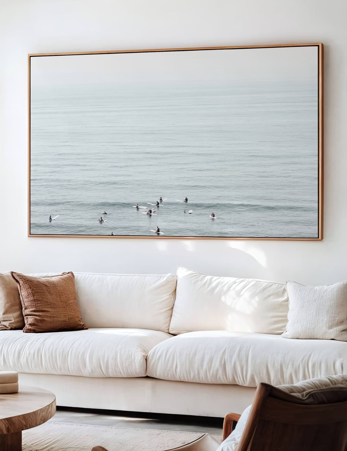 Framed surfing photo hung on a wall in a sunlit room