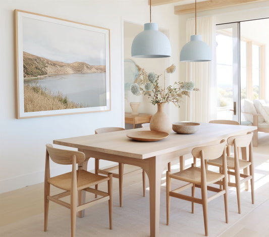 Framed photo of: Drakes Bay 7384 displayed on a wall in a coastal dining room.