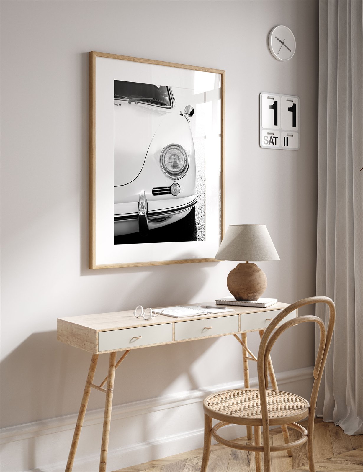 Framed photo of: Porsche 8259 displayed above a desk in a neural office.