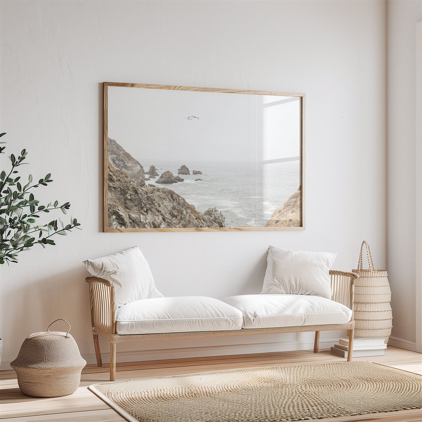 Framed photo of: Bodega Head 7714 displayed above a couch in a neutral room.