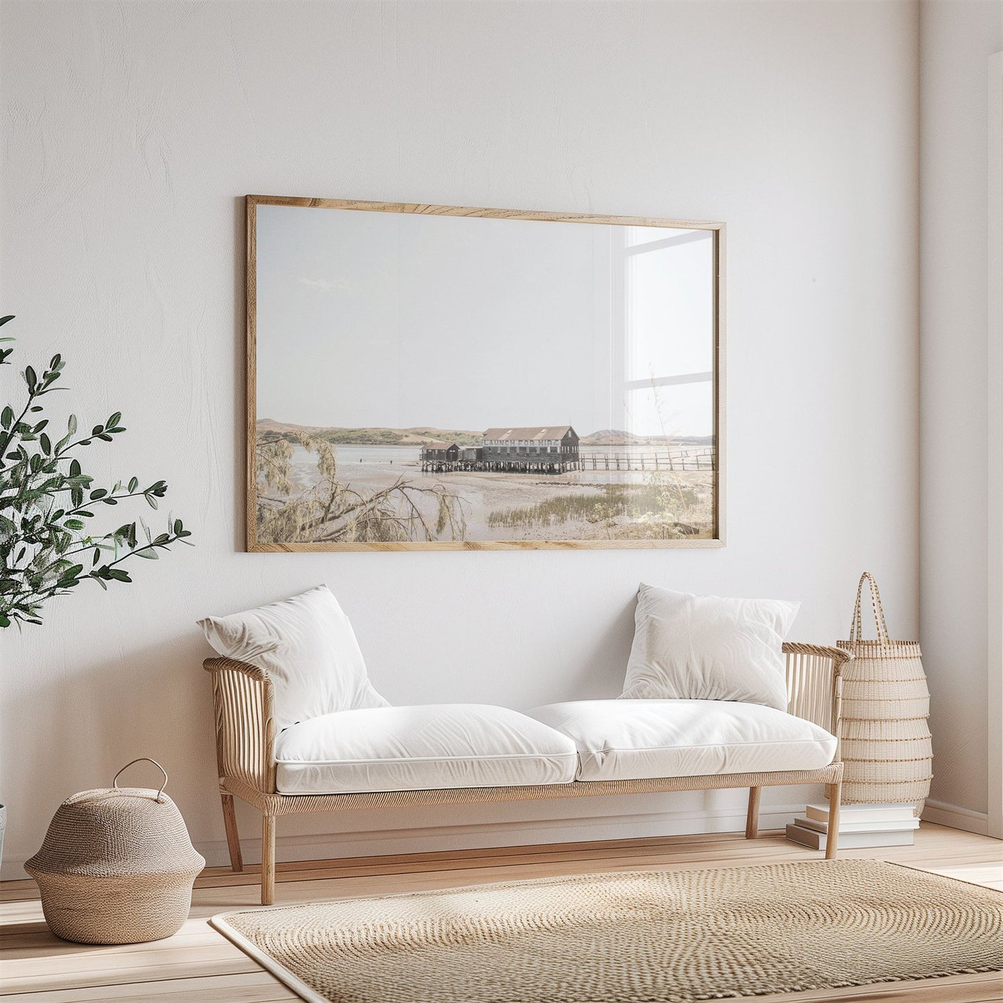 Framed photo of: Tomales Bay 7146 displayed above couch in a neutral living room.