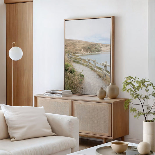 Framed canvas photo of: Drakes Bay 7374 displayed above a console in a modern living room.