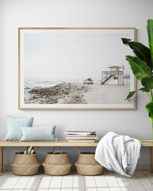 Landscape beach photography of Salt Creek Beach, with lifeguard tower SC 4 in the foreground, and many people enjoying the beach and ocean in the distance. A beach vibes print. Photograph in minimalist mock up.