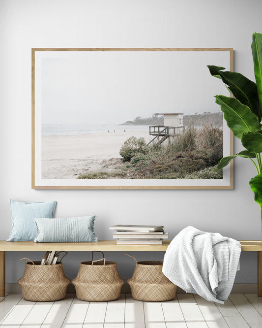 Landscape beach photography of Salt Creek Beach, with lifeguard tower SC 3 in the foreground, and many people enjoying the beach and ocean in the distance. A beach vibes print. Photograph in minimalist mock up.