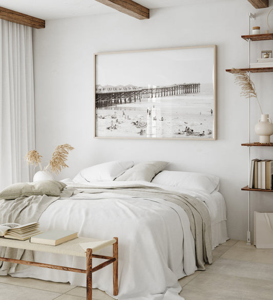 Sepia beach photo of Crystal Pier in Pacific Beach, San Diego, with people on the sandy beach. This framed coastal print showcases iconic beach scenes. Photograph in minimalist mock up.
