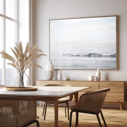 Horizontal minimalist ocean art with a close-up blue waves print of water, featuring subtle ripples and soft textures, ideal as a neutral ocean print, surfers in the waves. Photograph in minimalist mock up.