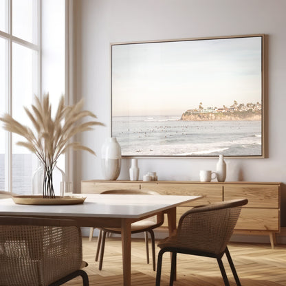 Landscape San Diego beach print of Tourmaline Beach, Pacific Beach, San Diego, showing a large group of surfers in the water near a residential cliff. This surf vibes print captures the local surf scene. Photograph in minimalist mock up.