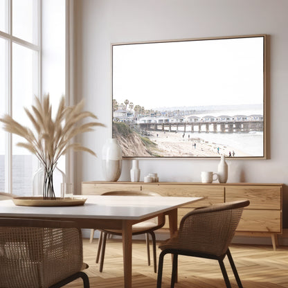 Landscape San Diego beach print of Pacific Beach's Crystal Pier, featuring its unique houses extending over the water, with people on the sandy shore. This iconic beach print is great for beach decor. Photograph in minimalist mock up.