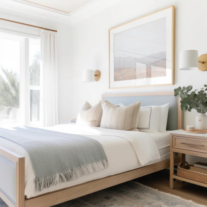 Minimalist art print of hazy mountains layered in soft tones, creating a calm ocean print aesthetic. This horizontal minimalist art print can fit a neutral ocean print theme. Photograph in minimalist mock up.
