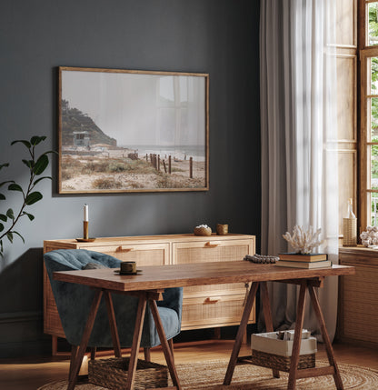Landscape coastal photography of a light-colored lifeguard tower at a Southern California beach, with a rustic wooden fence leading towards the ocean waves. This tranquil beachscape print is ideal for beach cottage wall decor or a calm beach print. Photograph in minimalist mock up.