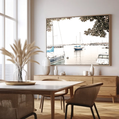 Landscape coastal photography of sailboats in San Diego Bay, framed by tree branches. This calm nautical print offers a coastal theme wall art. Photograph in minimalist mock up.