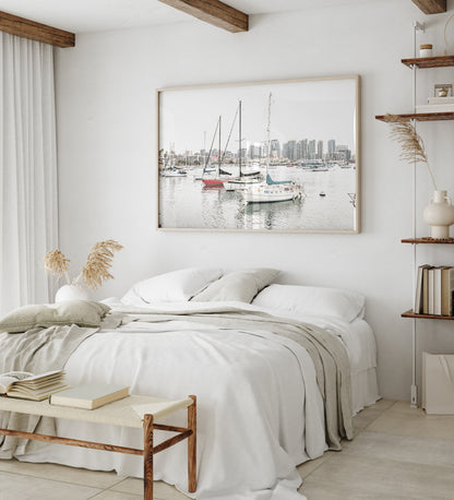 A horizontal San Diego print showcasing numerous sailboats in San Diego Harbor with the city skyline in the background. This modern coastal print embodies the Southern California coastal photography, perfect for a large beach wall art. Photograph in minimalist mock up.