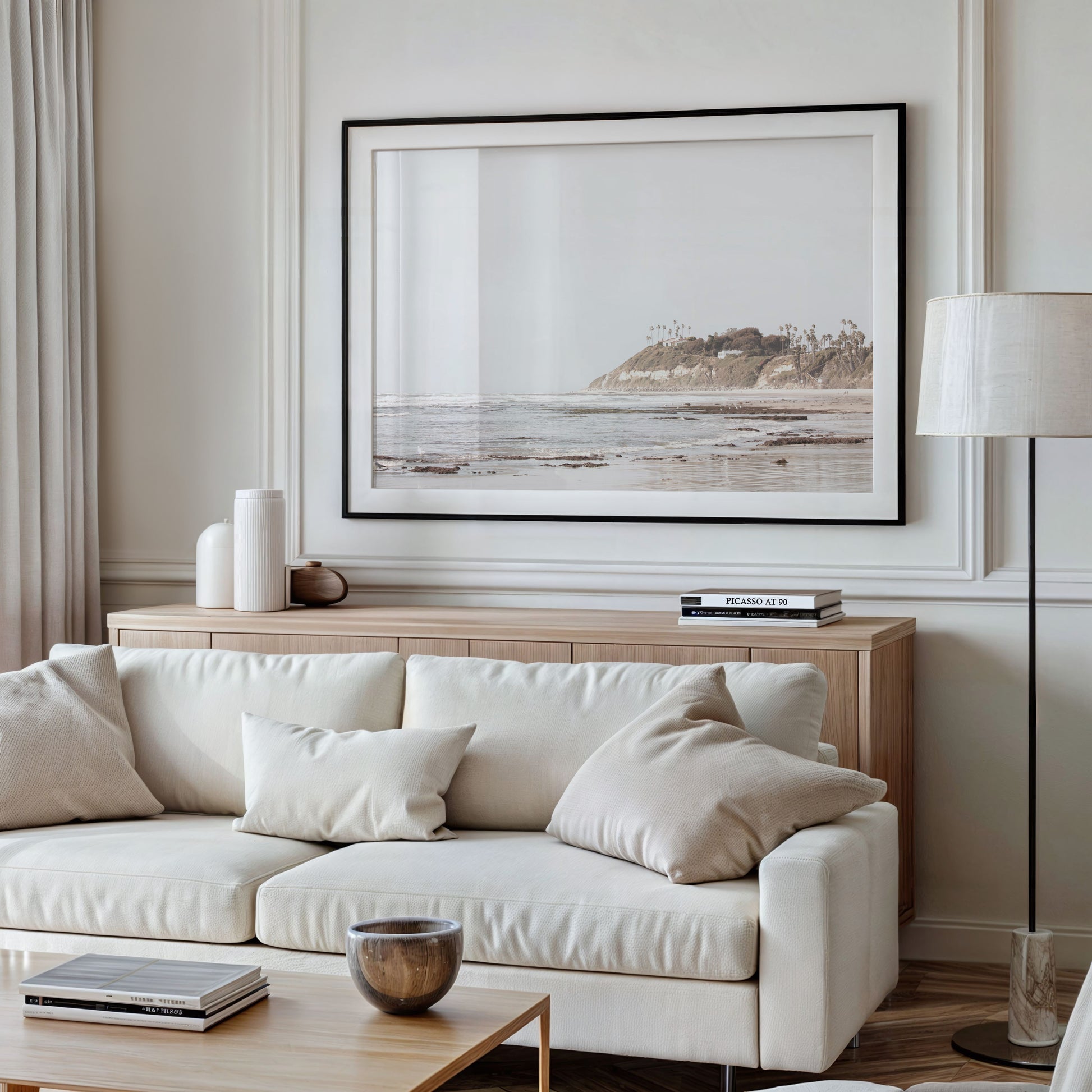 Framed Fine Art photograph of 
Swamis Beach above a couch