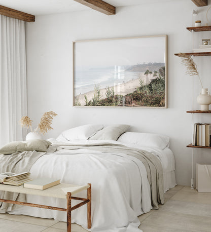 Landscape San Diego beach print showing seascape with gentle ocean waves in the water near a sandy cliff. Photograph in minimalist mock up.