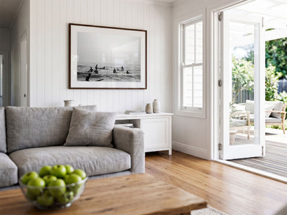 Framed photo of: Swamis 6683 displayed on a coastal living room wall above a console. 