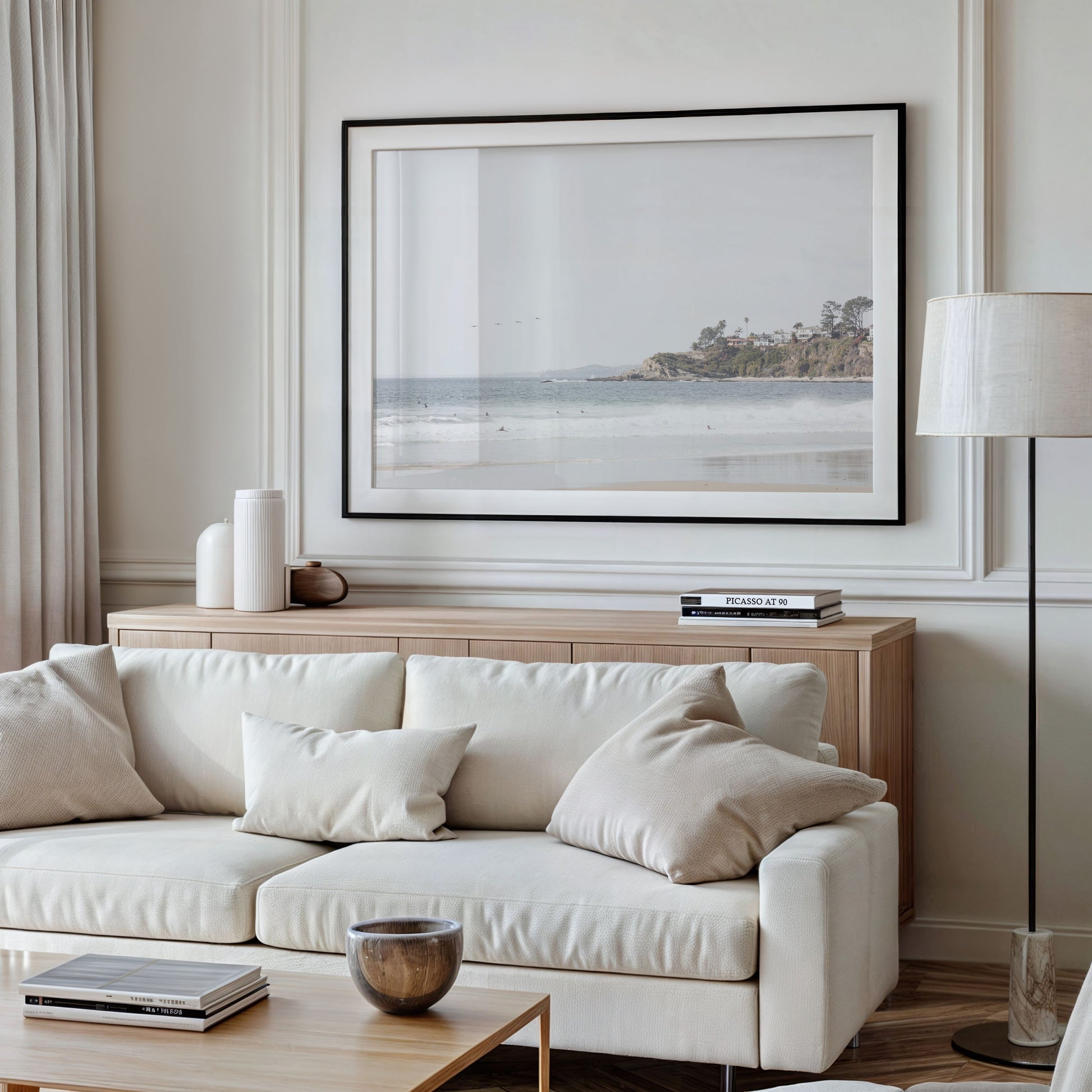 Landscape surf wall decor featuring surfers in the ocean near Salt Creek Beach, with a distant residential coastline and crashing waves. This print captures the surf vibes. Photograph in minimalist mock up.