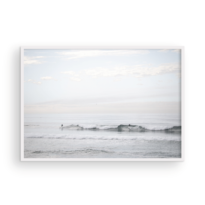 Horizontal minimalist ocean art with a close-up blue waves print of water, featuring subtle ripples and soft textures, ideal as a neutral ocean print, surfers in the waves. Photograph in minimalist mock up.