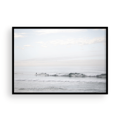 Horizontal minimalist ocean art with a close-up blue waves print of water, featuring subtle ripples and soft textures, ideal as a neutral ocean print, surfers in the waves. Photograph in minimalist mock up.