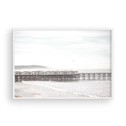 Landscape coastal photography of Crystal Pier in Pacific Beach, San Diego, extending into the calm ocean with gentle waves. Photograph in minimalist mock up