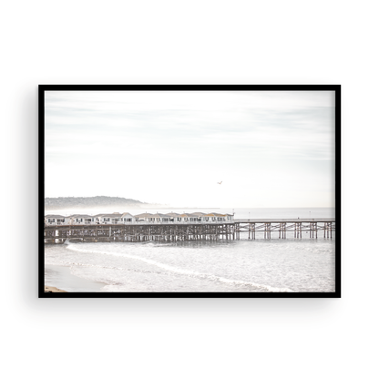 Landscape coastal photography of Crystal Pier in Pacific Beach, San Diego, extending into the calm ocean with gentle waves. Photograph in minimalist mock up