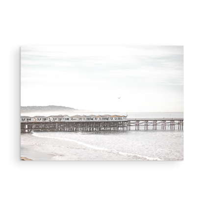 Landscape coastal photography of Crystal Pier in Pacific Beach, San Diego, extending into the calm ocean with gentle waves. Photograph in minimalist mock up