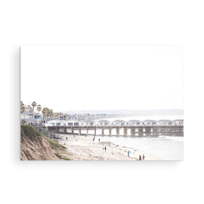 Landscape San Diego beach print of Pacific Beach's Crystal Pier, featuring its unique houses extending over the water, with people on the sandy shore. This iconic beach print is great for beach decor. Photograph in minimalist mock up.