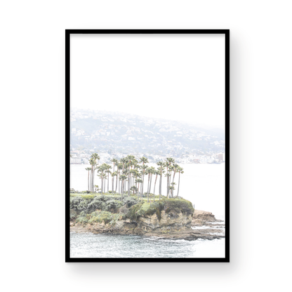 Vertical coastal photography of Laguna Beach, San Diego, featuring a fine art giclee print featuring palm trees on a small island in a body of water. Photograph in minimalist mock up.