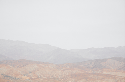 Minimalist art print of hazy mountains layered in soft tones, creating a calm ocean print aesthetic. This horizontal minimalist art print can fit a neutral ocean print theme. 