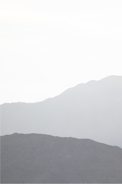 Minimalist vertical art print of hazy mountains layered in soft tones. Located in Palms Springs, California.