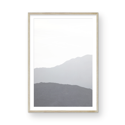 Minimalist vertical art print of hazy mountains layered in soft tones. Located in Palms Springs, California. Photograph in minimalist mock up