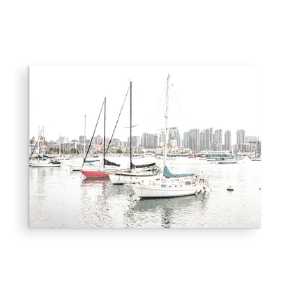A horizontal San Diego print showcasing numerous sailboats in San Diego Harbor with the city skyline in the background. This modern coastal print embodies the Southern California coastal photography, perfect for a large beach wall art. Photograph in minimalist mock up.