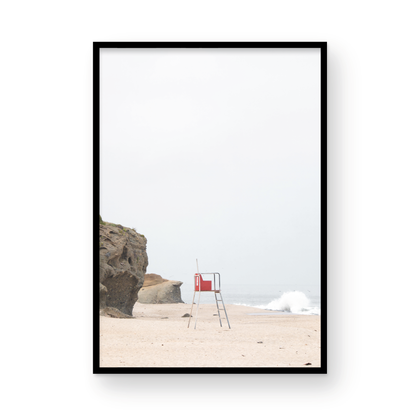 Vertical coastal photography featuring a red and white lifeguard chair and a calm ocean background, located in Laguna California. Photograph in minimalist mock up.
