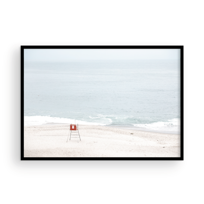 Horizontal coastal photography featuring a red and white lifeguard chair and a calm ocean background, located in Laguna California. Photograph in minimalist mock up.