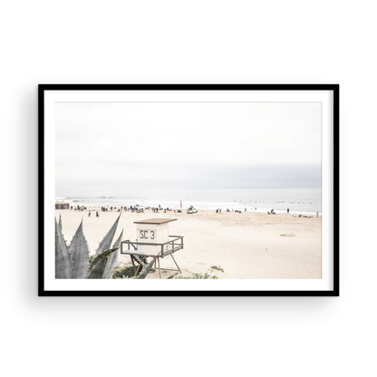 Landscape beach photography of Salt Creek Beach, with lifeguard tower SC 3 in the foreground, and many people enjoying the beach and ocean in the distance. A beach vibes print. Photograph in minimalist mock up.