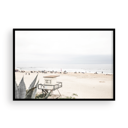 Landscape beach photography of Salt Creek Beach, with lifeguard tower SC 3 in the foreground, and many people enjoying the beach and ocean in the distance. A beach vibes print. Photograph in minimalist mock up.