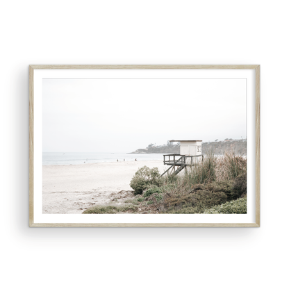 Landscape beach photography of Salt Creek Beach, with lifeguard tower SC 3 in the foreground, and many people enjoying the beach and ocean in the distance. A beach vibes print. Photograph in minimalist mock up.