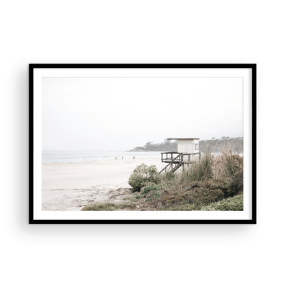 Landscape beach photography of Salt Creek Beach, with lifeguard tower SC 3 in the foreground, and many people enjoying the beach and ocean in the distance. A beach vibes print. Photograph in minimalist mock up.