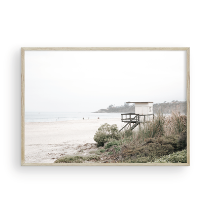 Landscape beach photography of Salt Creek Beach, with lifeguard tower SC 3 in the foreground, and many people enjoying the beach and ocean in the distance. A beach vibes print. Photograph in minimalist mock up.