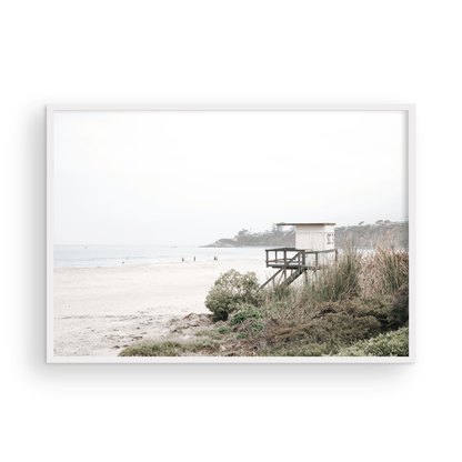Landscape beach photography of Salt Creek Beach, with lifeguard tower SC 3 in the foreground, and many people enjoying the beach and ocean in the distance. A beach vibes print. Photograph in minimalist mock up.