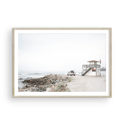Landscape beach photography of Salt Creek Beach, with lifeguard tower SC 4 in the foreground, and many people enjoying the beach and ocean in the distance. A beach vibes print. Photograph in minimalist mock up.
