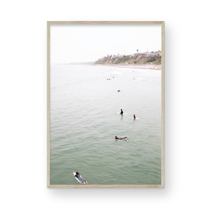 Vertical surf print of surfers floating in the ocean waves at a Southern California beach, with a distant coastline. This image captures surfing art and a minimalist surf vibe. Photograph in minimalist mock up.