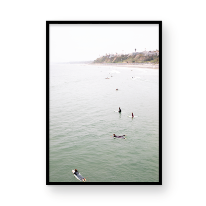 Vertical surf print of surfers floating in the ocean waves at a Southern California beach, with a distant coastline. This image captures surfing art and a minimalist surf vibe. Photograph in minimalist mock up.