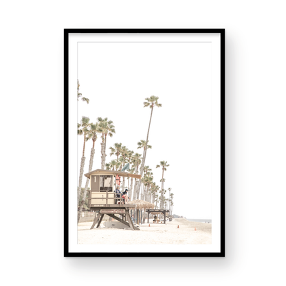 A landscape coastal photography view of San Clemente State Beach in Southern California, featuring a row of tall palm trees, a lifeguard tower, and people enjoying the calm beach. This vertical image evokes Summer Vibes Wall Art and tropical beach print aesthetics. Photograph in minimalist mock up.